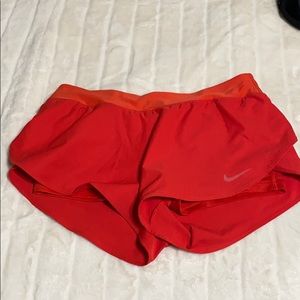 Red Nike shorts